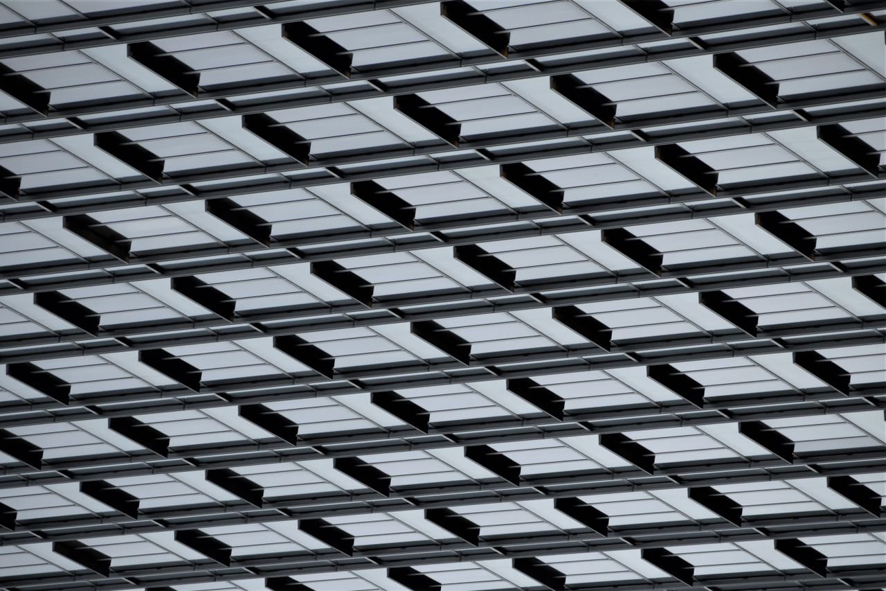 Abstract pattern of a modern glass ceiling with geometric design, perfect for architecture and design themes.